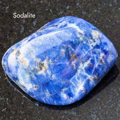 smooth sodalite crystal with dark grey background