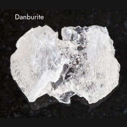 Danburite crystal with black background