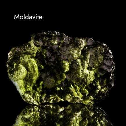 green Moldavite crystal with black background