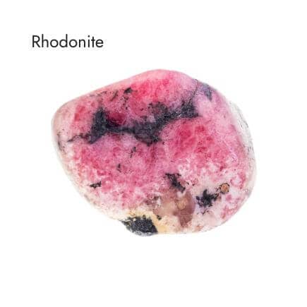 tumbled pink, black, white and brown rhodonite stone on white background