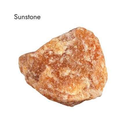 raw orange sunstone crystal on white background