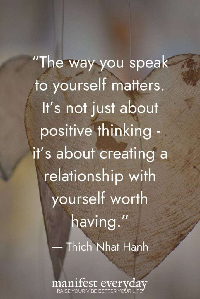 Mindful self-love quote by Thich Nhat Hanh overlaid on wooden heart texture background: ‘The way you speak to yourself matters. It’s not just about positive thinking - it’s about creating a relationship with yourself worth having.’ manifesteveryday.com