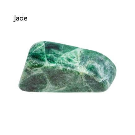 Tumbled, smooth green and white Jade stone on white background