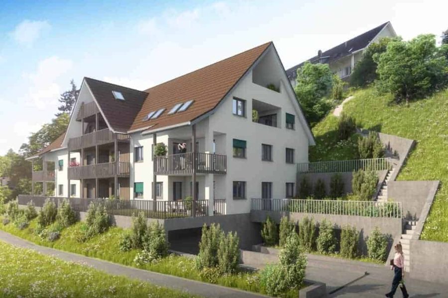 A modern three-story house on a hillside with balconies, surrounded by greenery, under a clear sky. a solitary pedestrian walks by on the street.