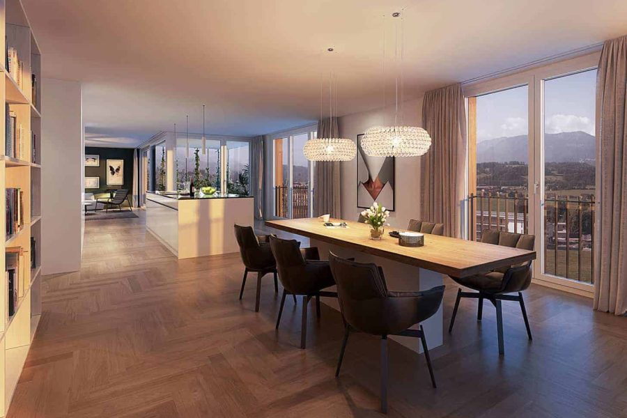 Modern dining room with a long wooden table, black chairs, pendant lights, and large windows showing a mountain view.