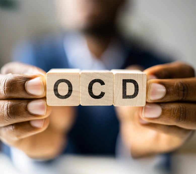Person holding OCD blocks in hands