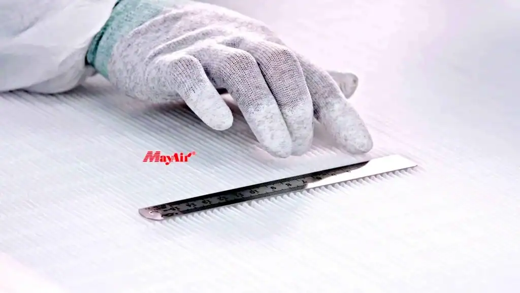 Highly skilled worker installing or inspecting a fiber optic or HVAC system with precision tools for optimal building climate control and air quality solutions.
