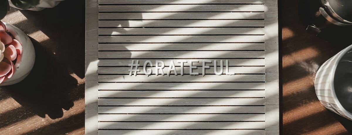 A sign that says Grateful to celebrate Gratitude Month.