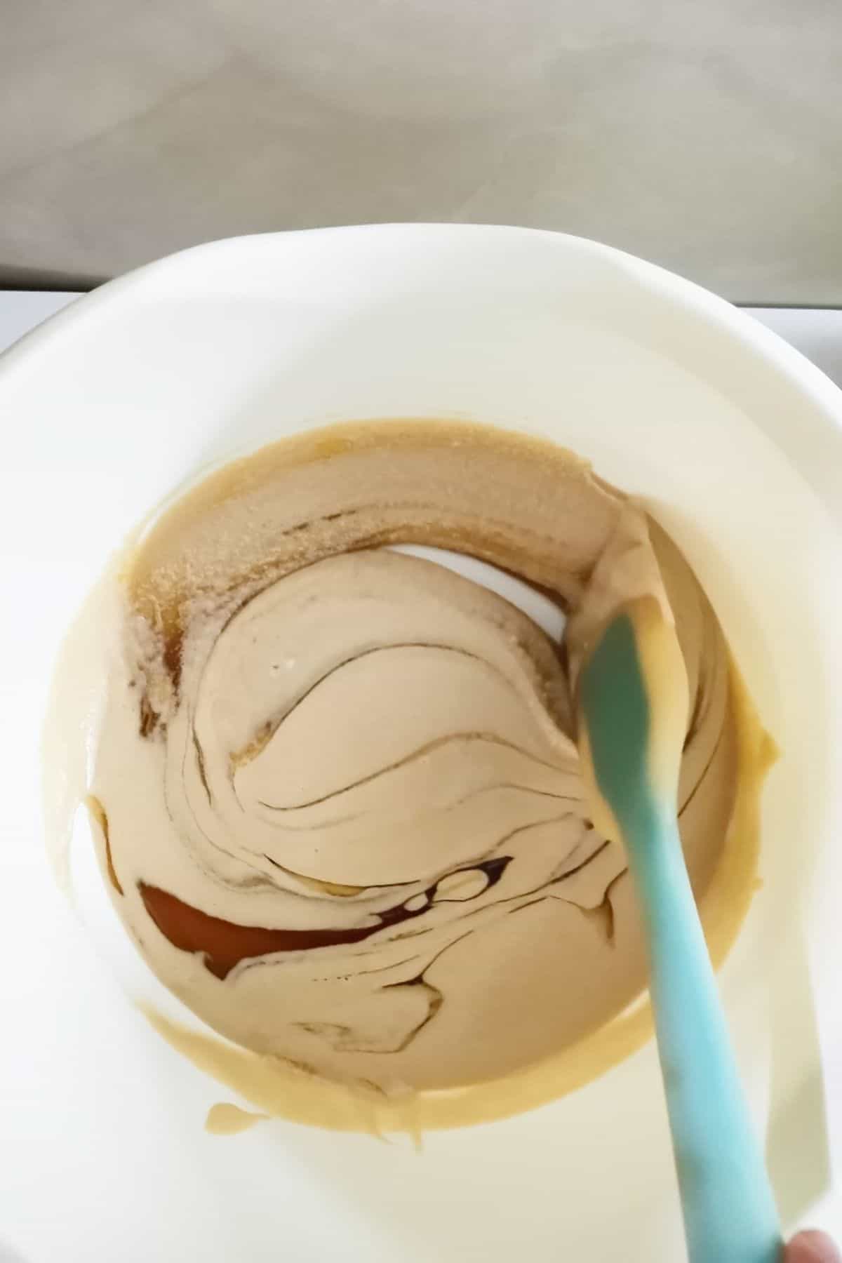 mixing tahini and honey in a large bowl