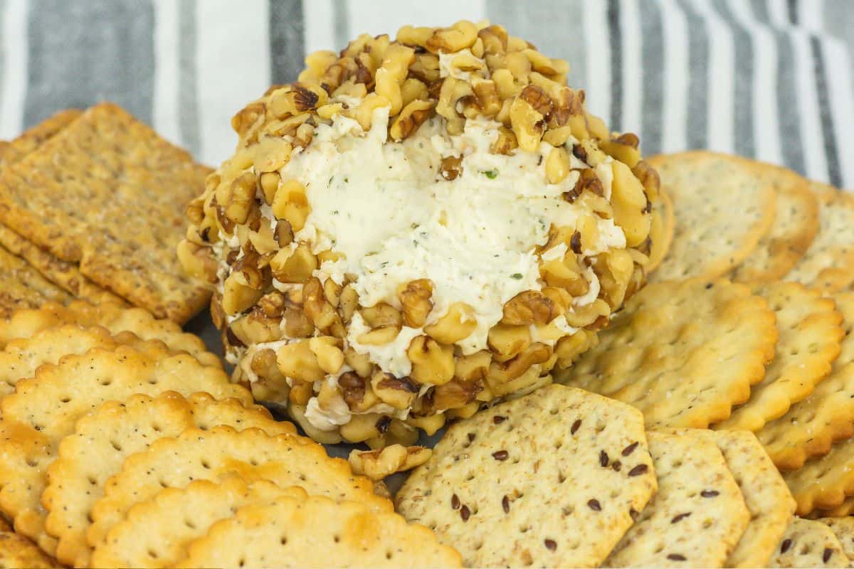 easy 3 ingredient cheese ball on a plate of crackers 