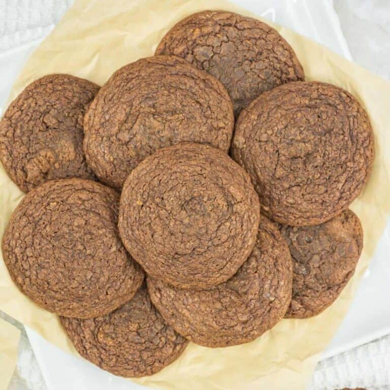easy nutella cookies with 3 ingredients on a plate piled high