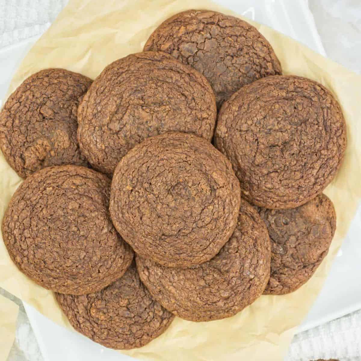 easy nutella cookies with 3 ingredients on a plate piled high