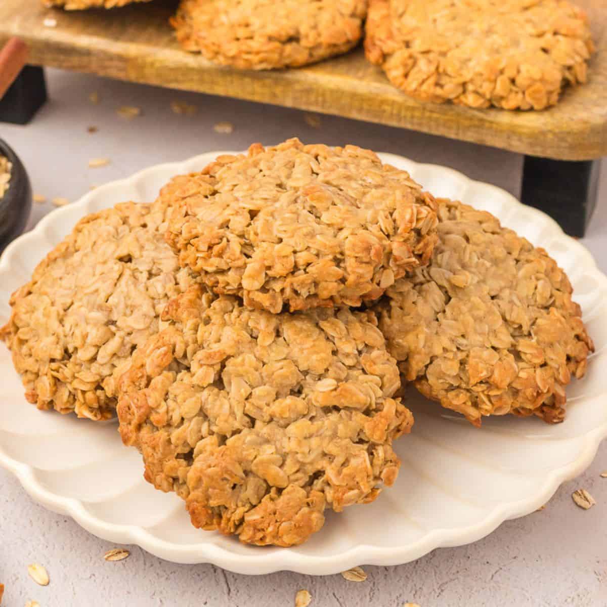 3 ingredient oatmeal cookies stacked on a plate made with oats, honey, and tahini