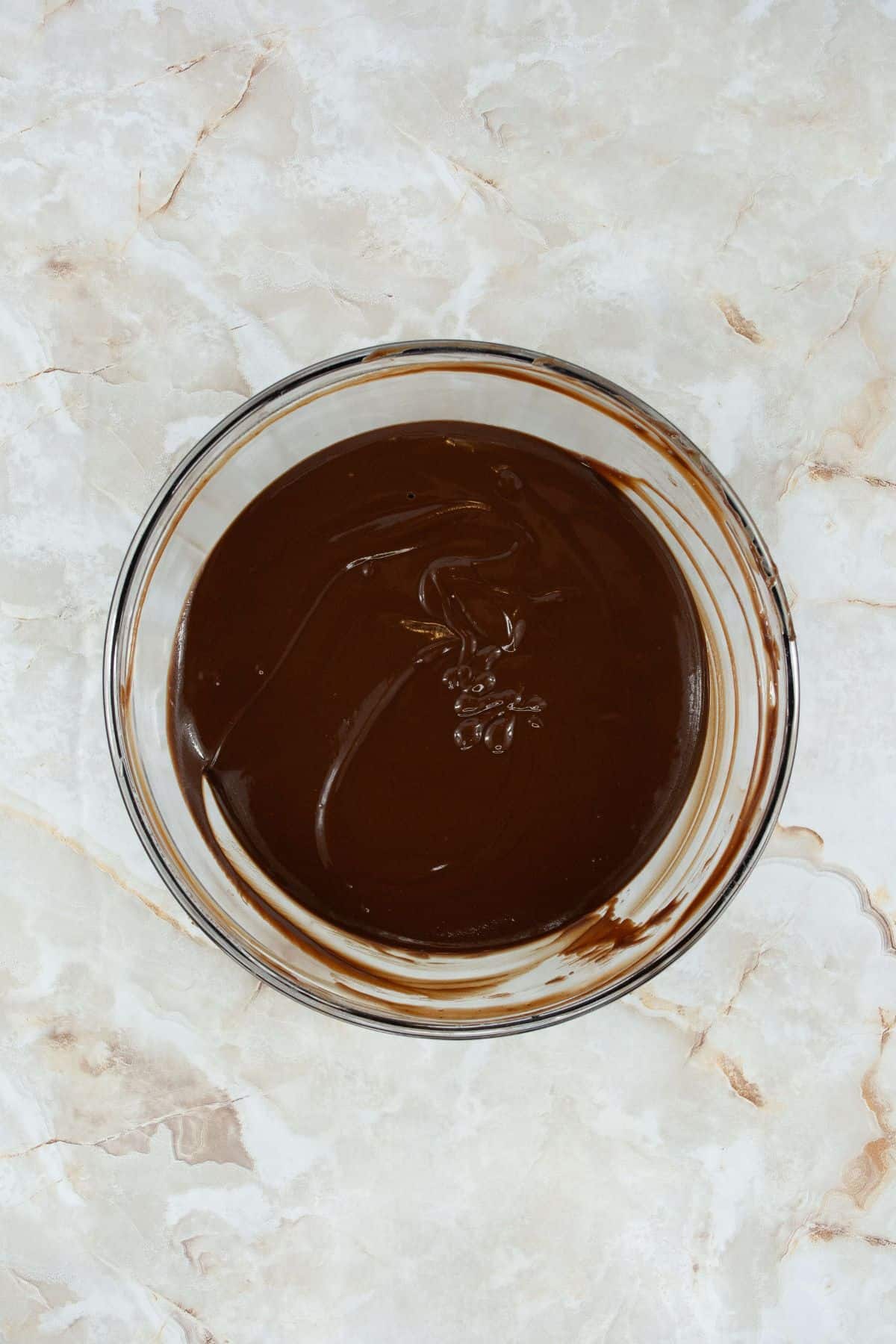 melted mixture of butter, chocolate chips, and salt in a large bowl