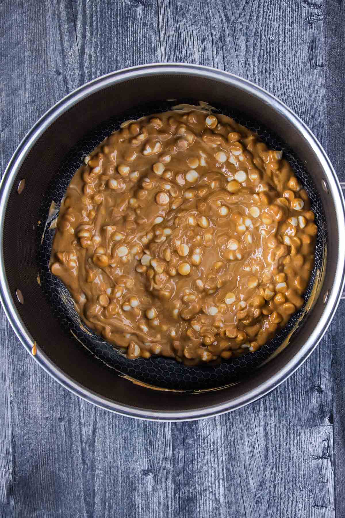 white chocolate chips and creamy peanut butter mixed in a large pot