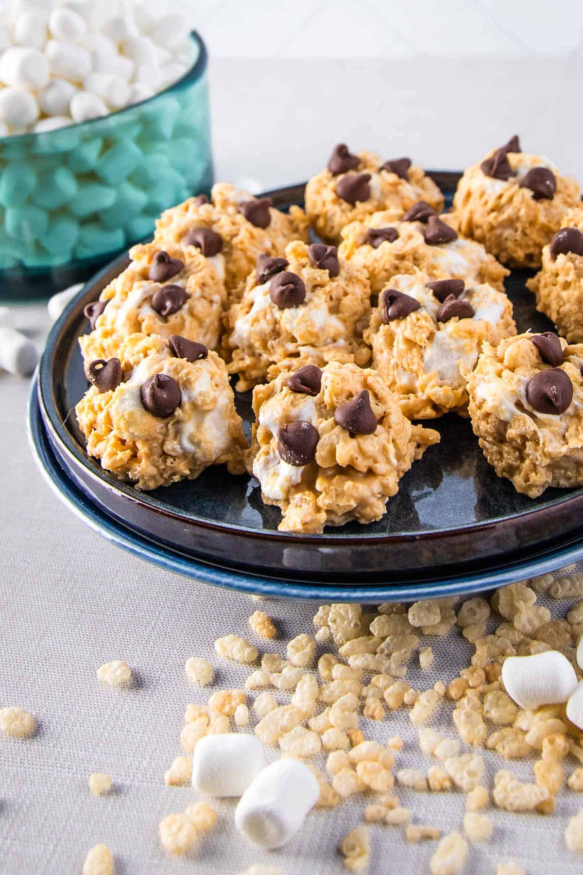 a plate of avalanche cookies; marshmallows and rice cereal in the background