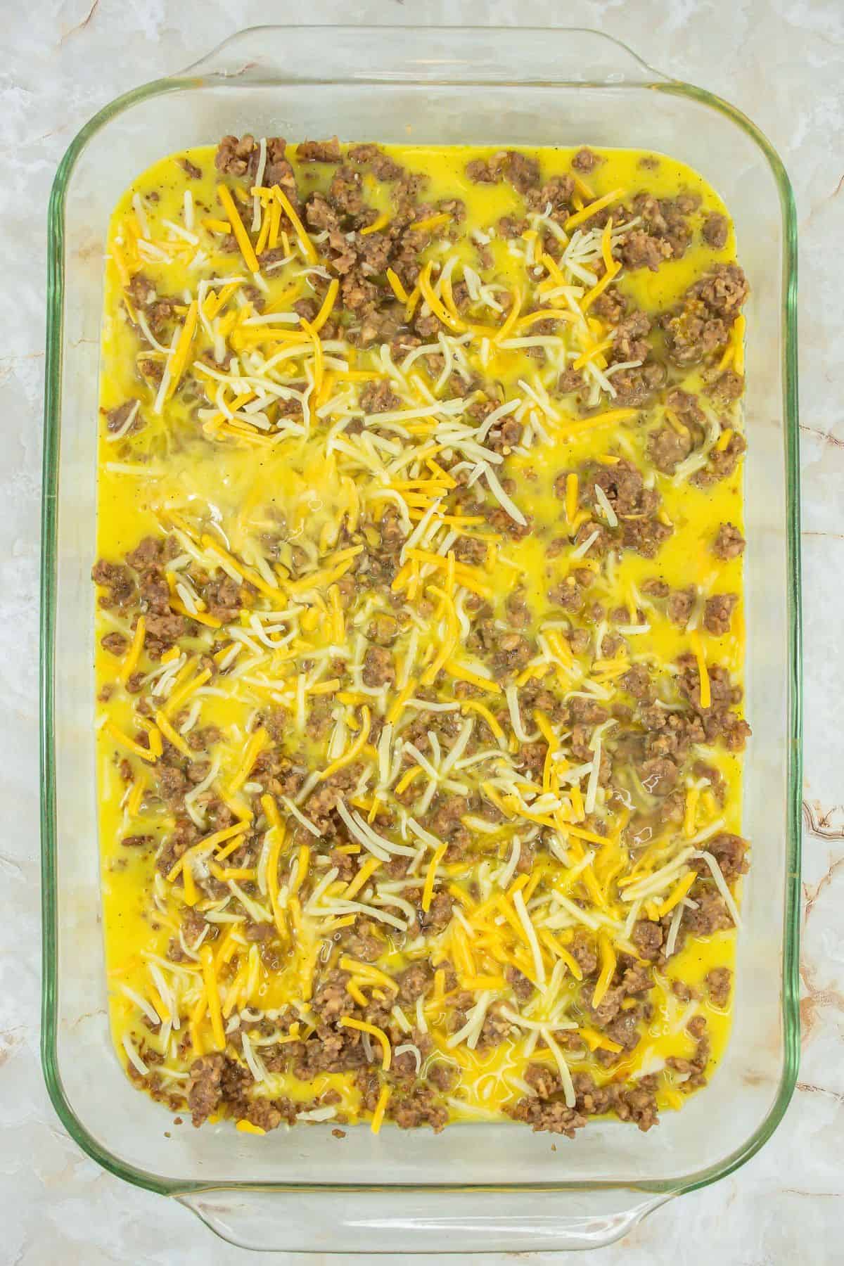 Biscuits and Gravy Casserole ingredients mixed it all up