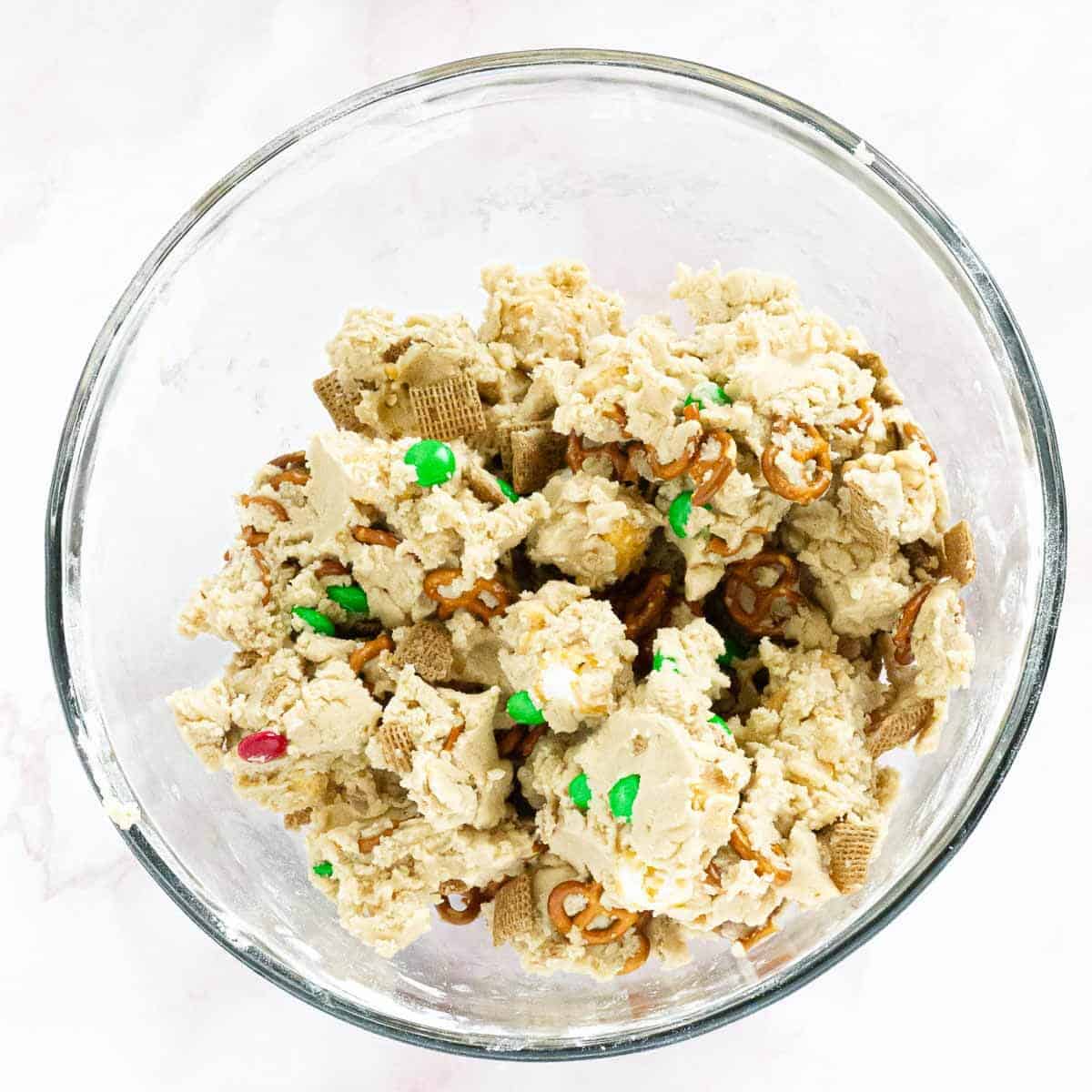 A bowl of dough fully combined with mix-ins.