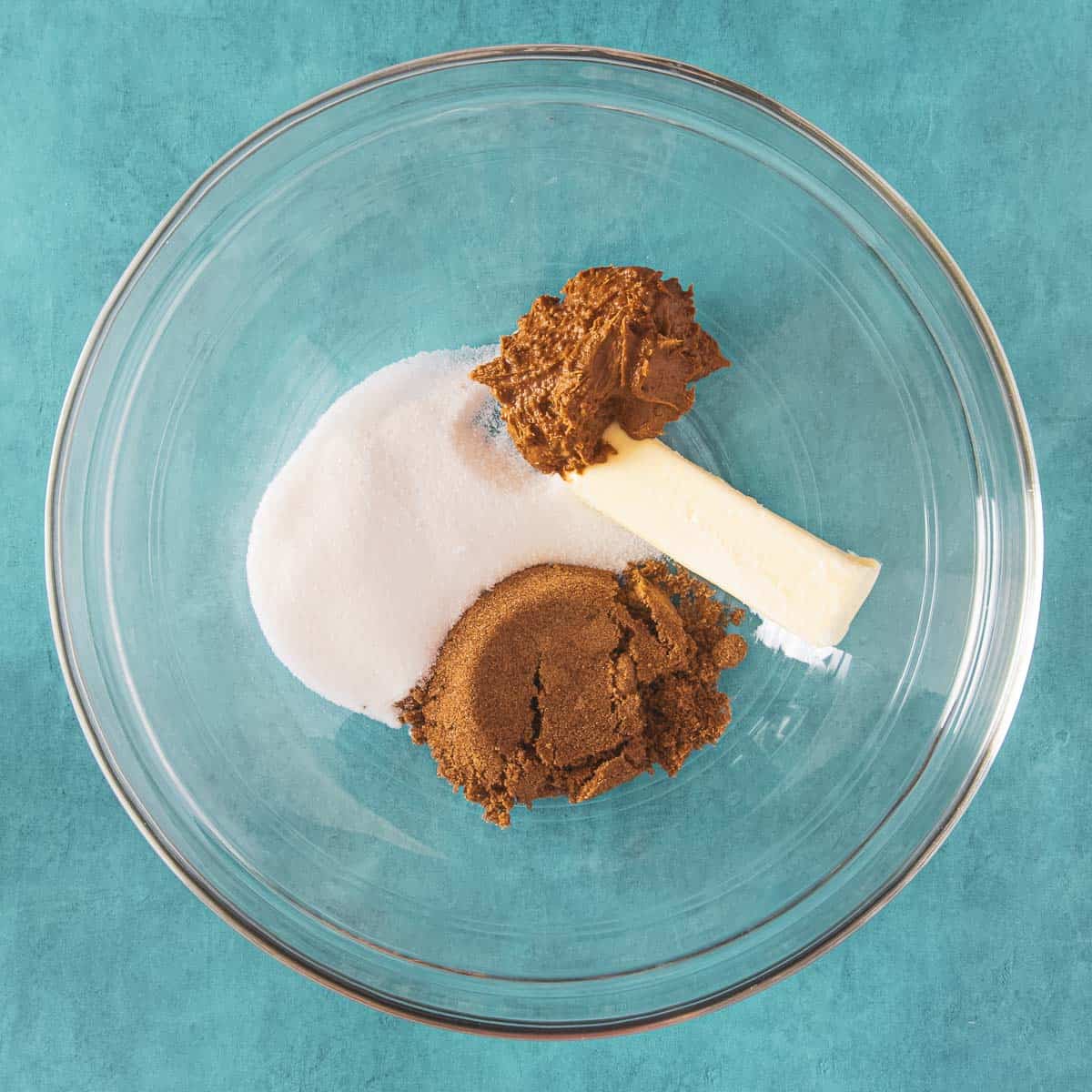 Butter, sugars, and Biscoff spread in a mixing bowl.