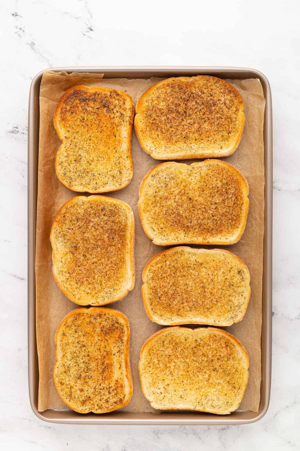 Fully toasted garlic bread with crispy edges and evenly browned surface.