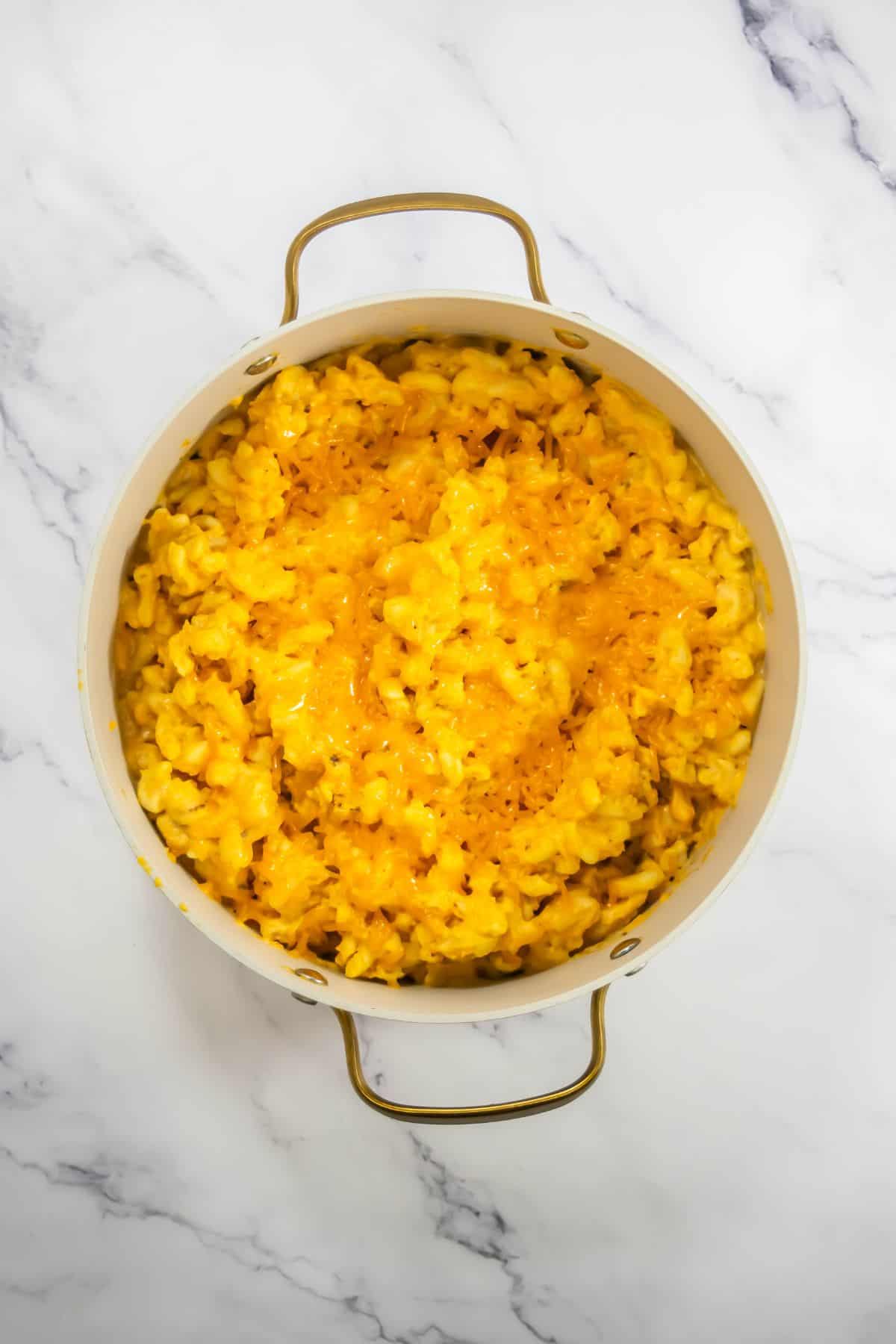 A pot of finished, perfectly creamy and cheesy macaroni.