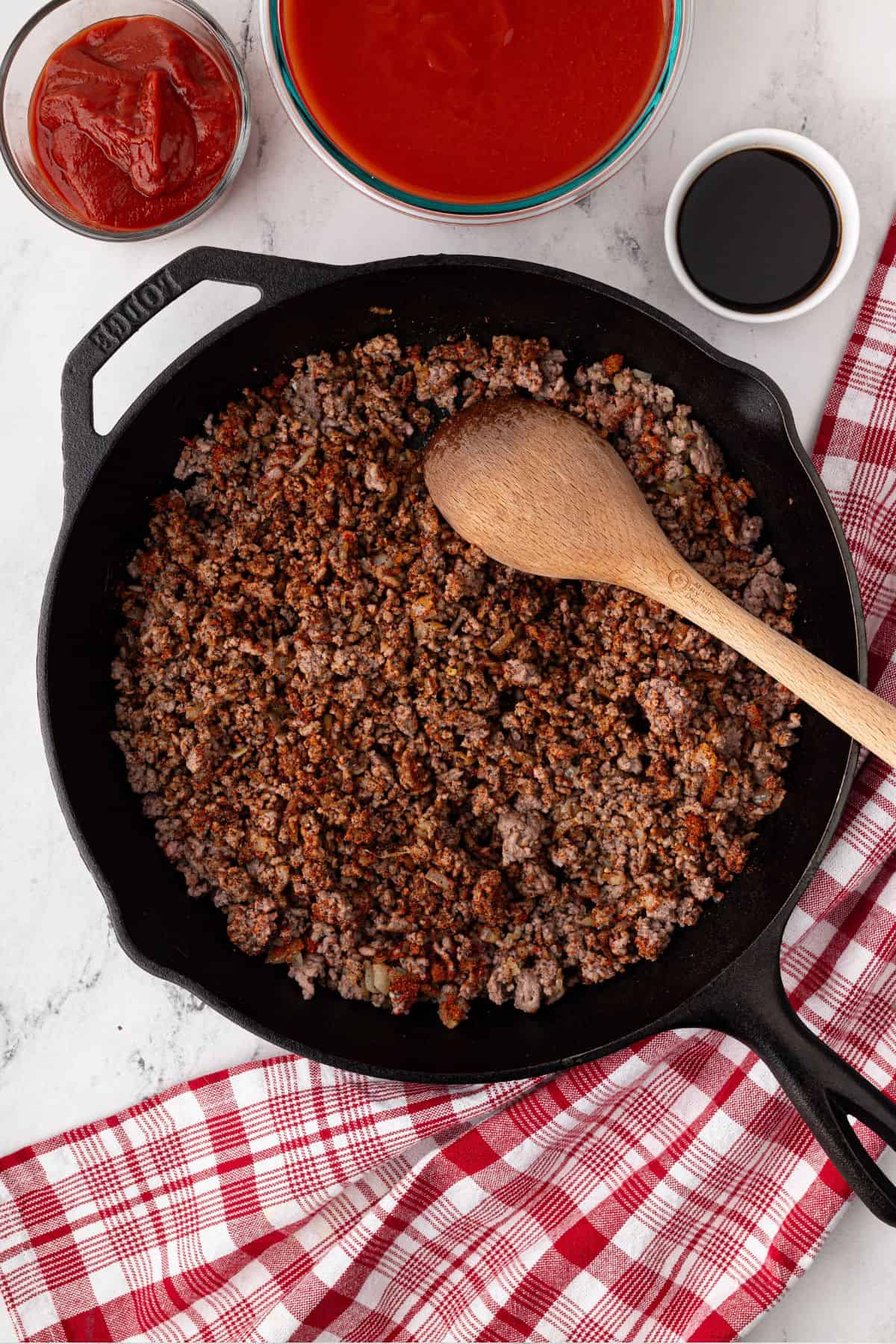 The seasoning is stirred into the beef, giving it a deeper color.