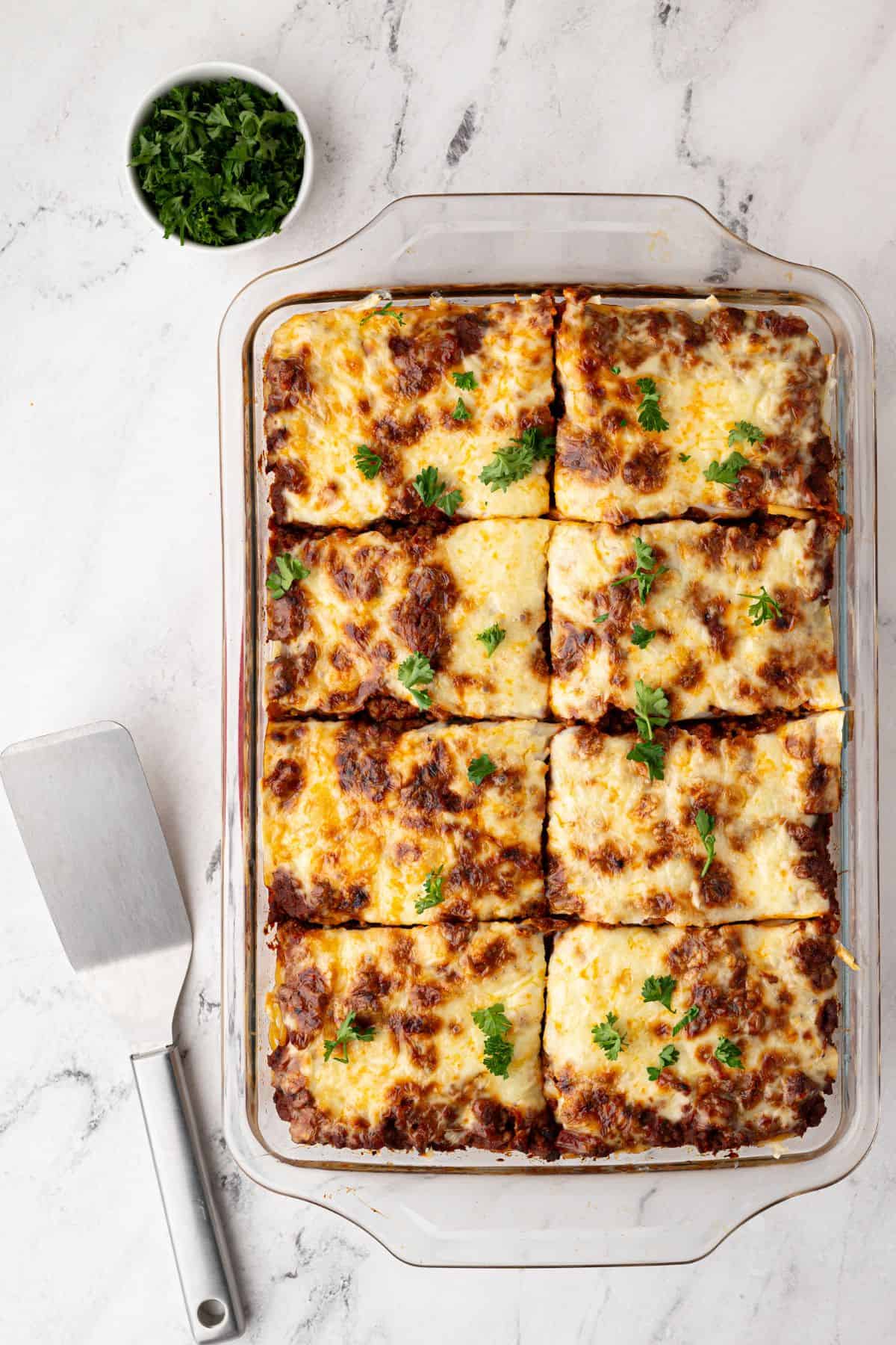 The baked dish cut into squares, ready to be served.