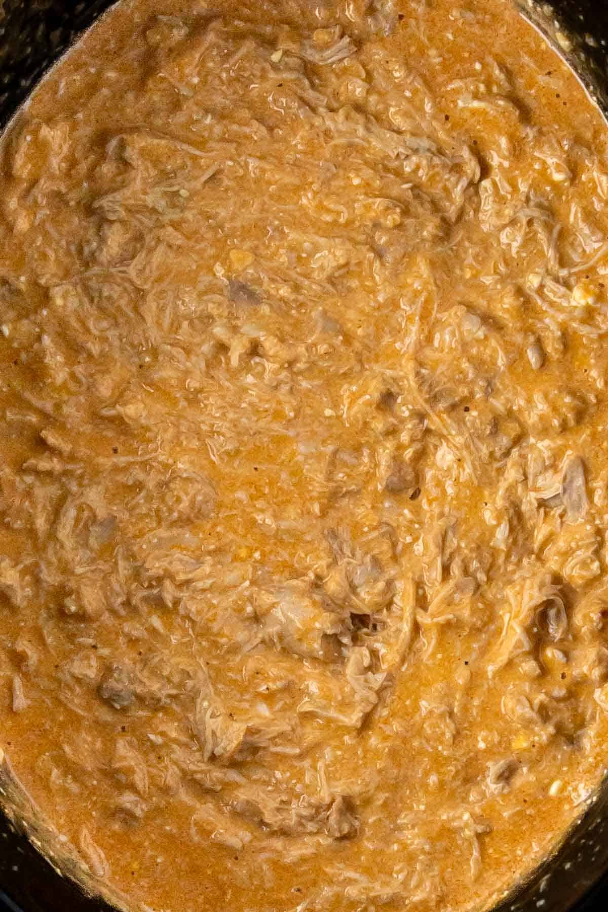 buffalo chicken dip with shredded chicken in the slow cooker