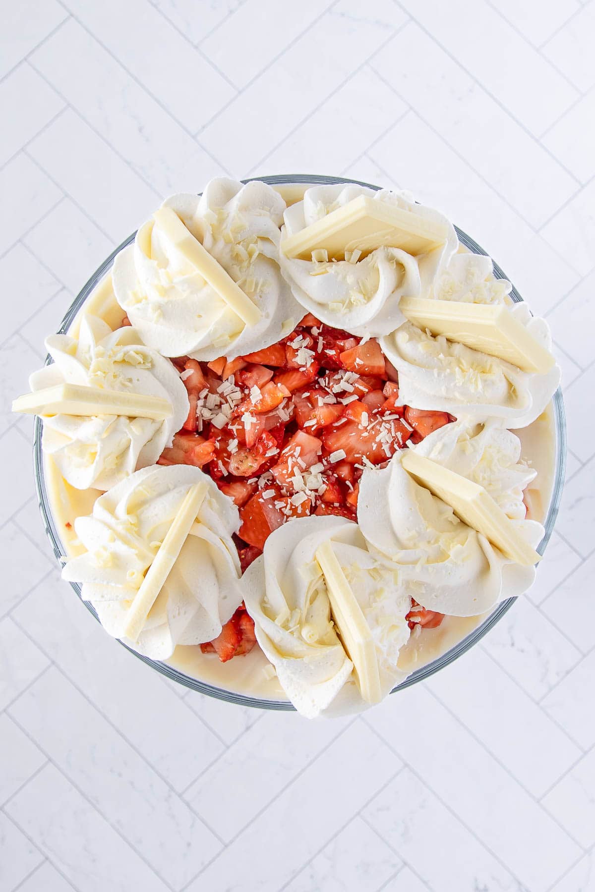 strawberry trifle finished with white chocolate bar pieces and grated chocolate