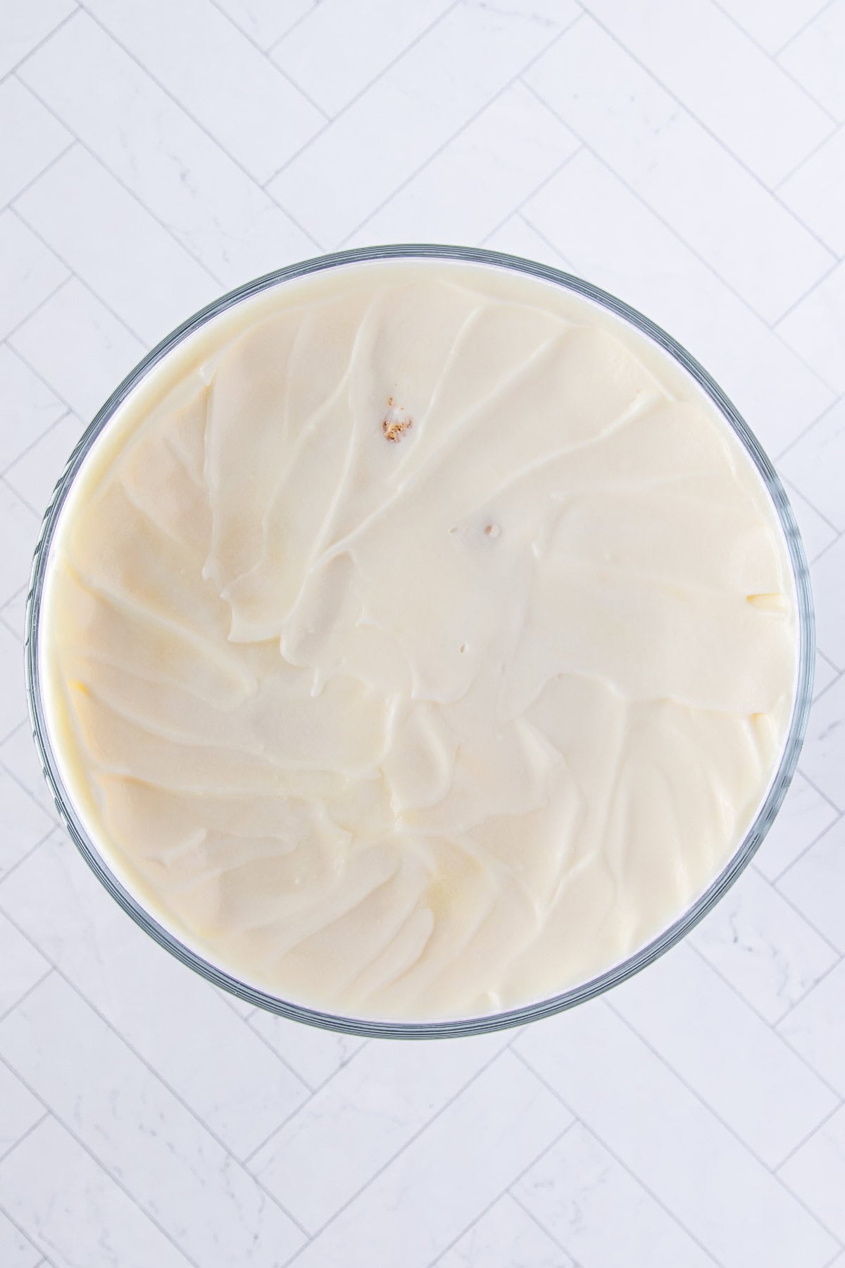 remaining prepared white chocolate pudding spread over the second layer of the angel food cake cubes