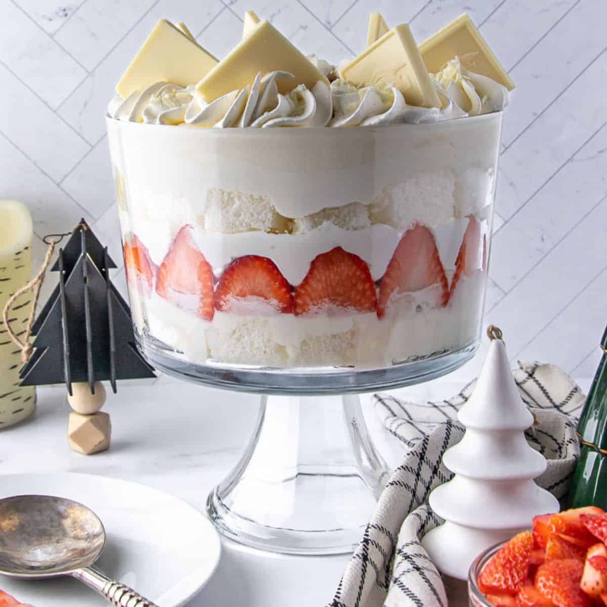 strawberry trifle with white chocolate in a glass trifle bowl