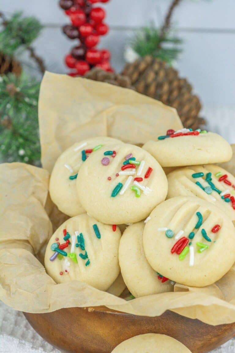 a group of whipped shortbread cookies with sprinkles