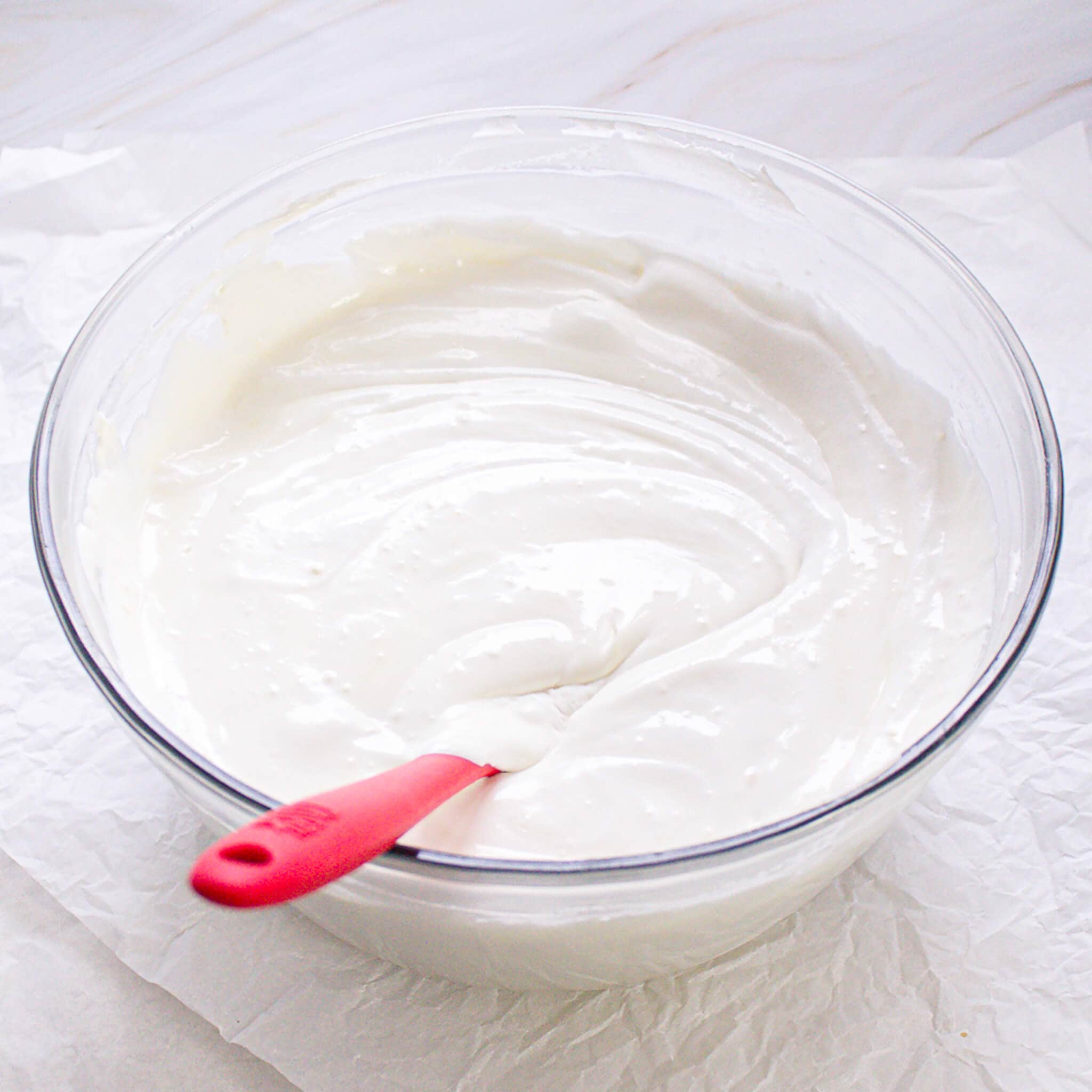 Smooth pudding mixture in a bowl with a spatula.