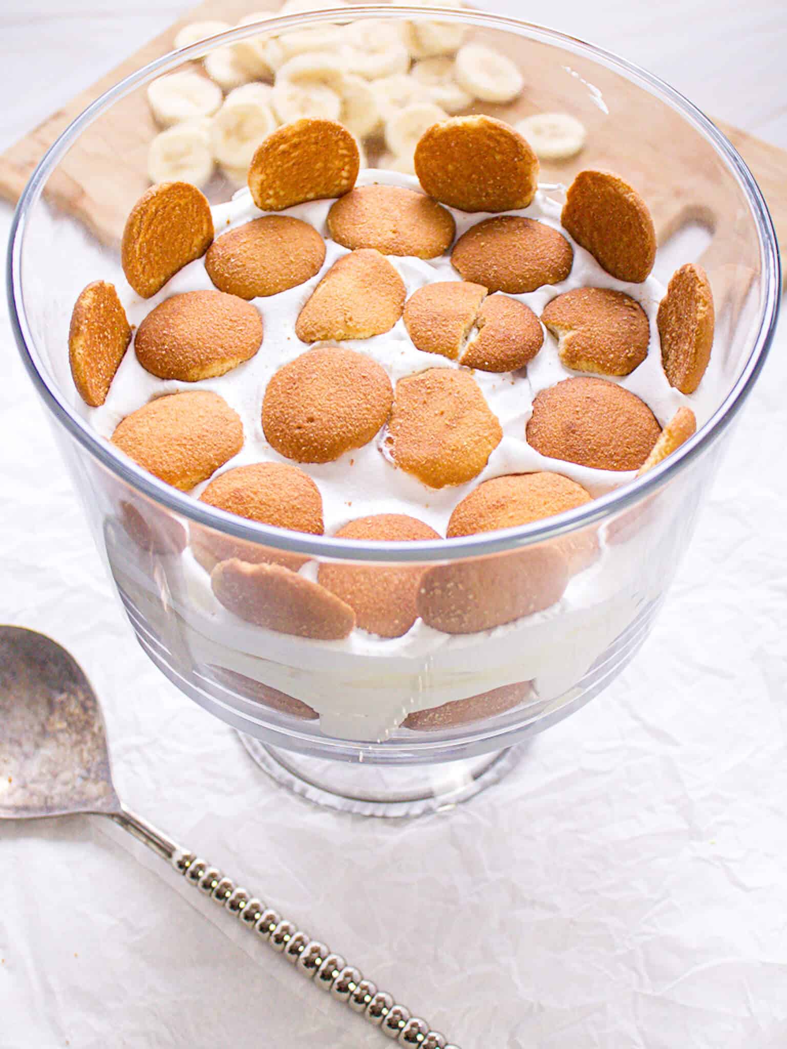 Layered pudding with vanilla wafers on top.