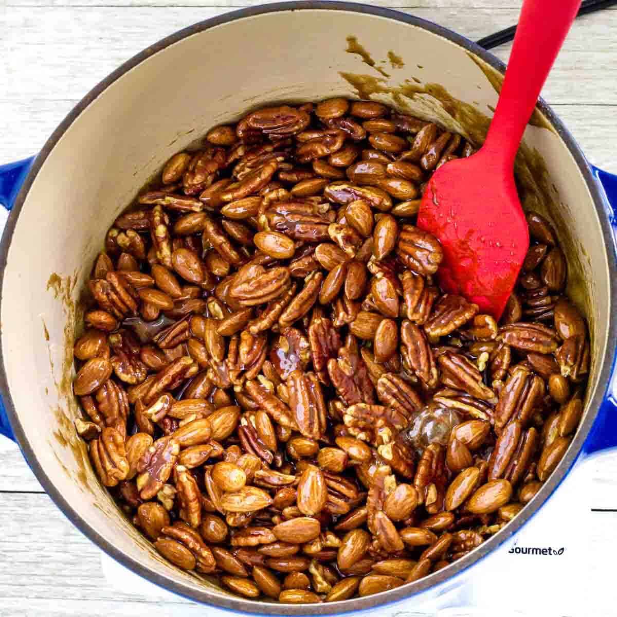 The nuts are evenly coated in the rich, spiced glaze before baking.