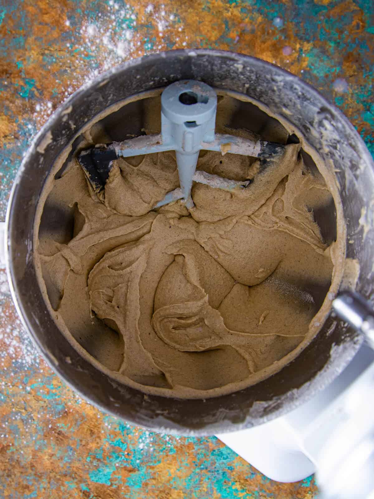A thick, well-mixed batter in the bowl of a stand mixer.