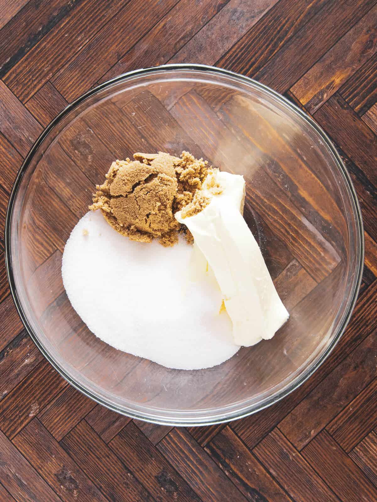 Softened butter, brown sugar, and white sugar ready to be creamed together.
