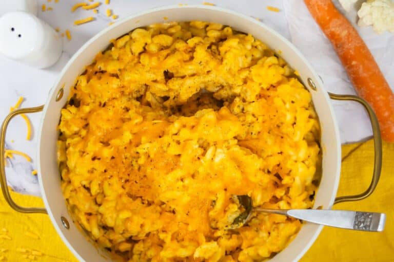 hidden veggie mac and cheese in a big pot with melted cheese on top
