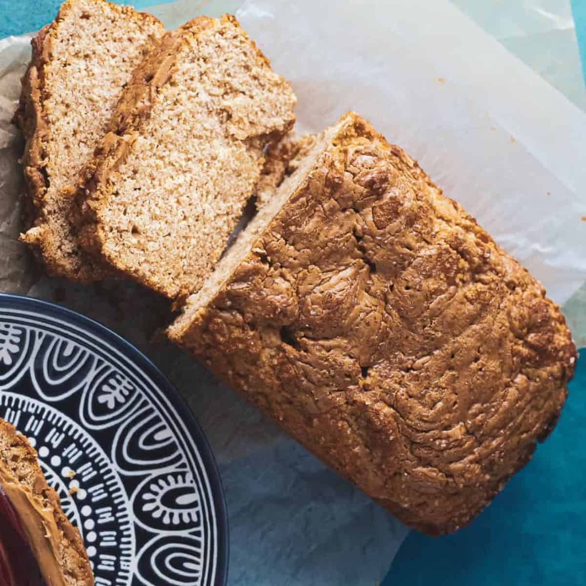 homemade peanut butter bread loaf with two slices taken out of the bread