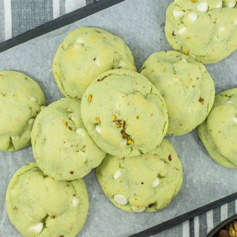Tray of pistachio pudding cookies all stacked on top of each other