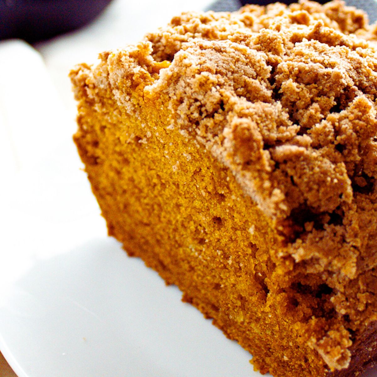 loaf of pumpkin bread cut in half showing the texture