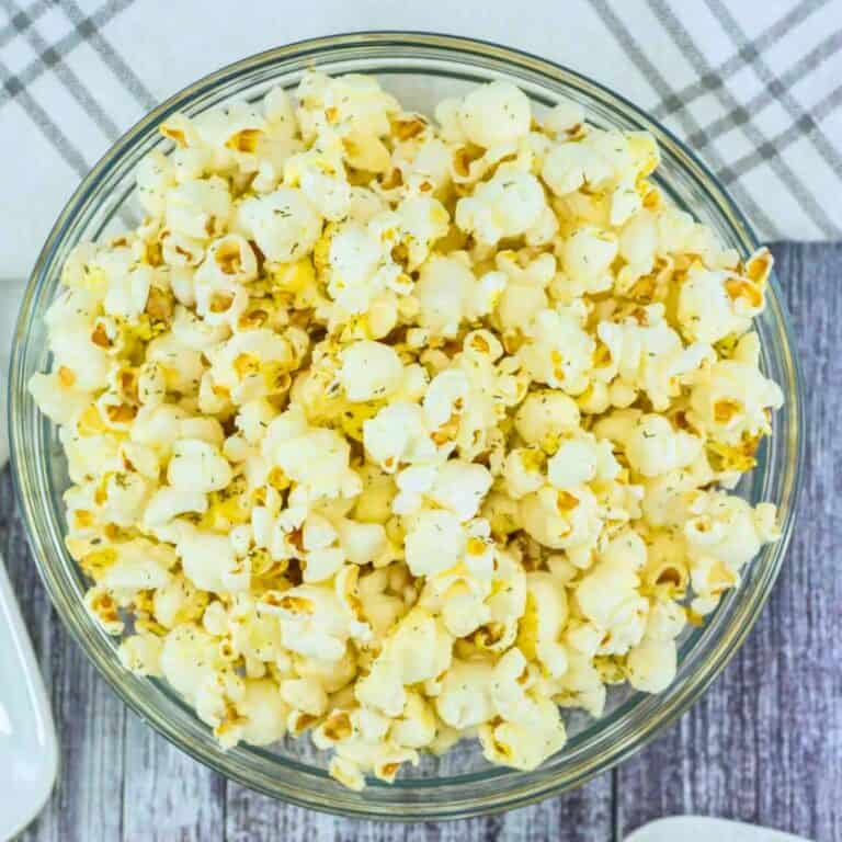 salt and vinegar seasoned popcorn in a clear glass bowl