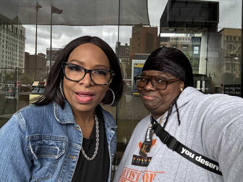 UOhnIt.com, diverse women taking a selfie outside urban building, empowering community and social engagement.