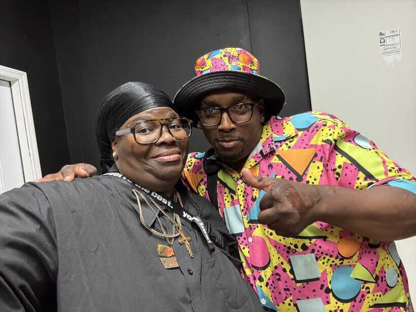 UOhnIt.com, vibrant colorful outfits, joyful duo, African American couple, lively fashion style, trendy and expressive fashion statement.