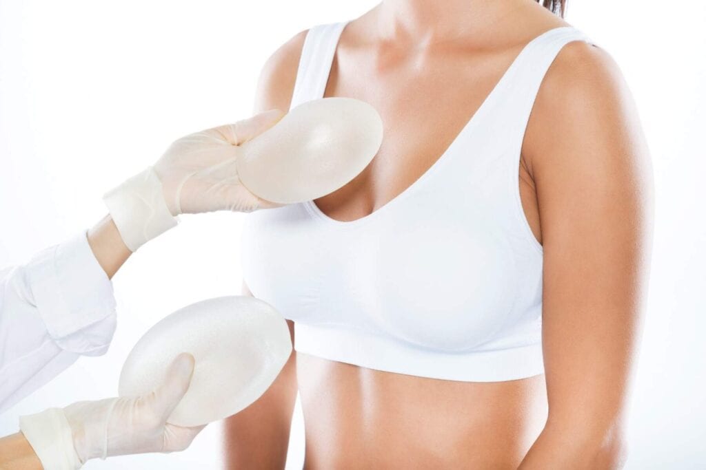 Medical procedure comparing breast lift and augmentation options in Albania.