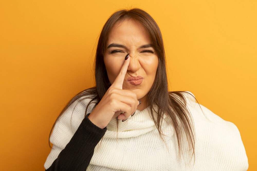 Woman with a bulbous nose tip.