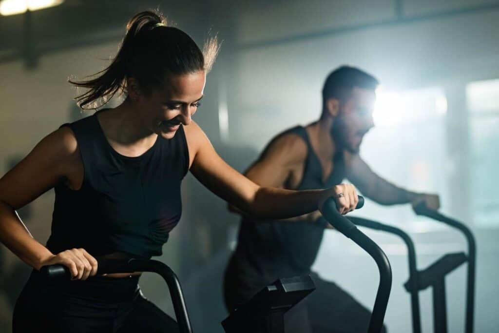 Women doing cardio workout for belly fat reduction at a gym in Albania.