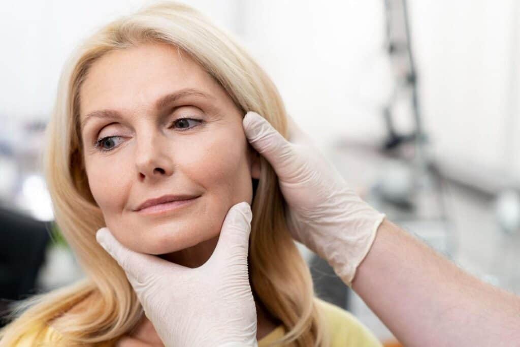 Woman receiving non-invasive anti-aging facial treatment in Albania.