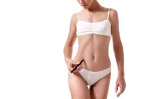 Woman in white underwear using smartphone, health and wellness concept.