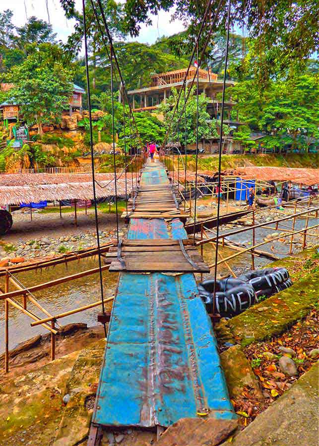 Bukit Lawang Jungle Trekking, Sumatra Orangutan Tour: How to See Bukit Lawang Orangutans 21 A network of rickety bridges connects the town on each side of the river